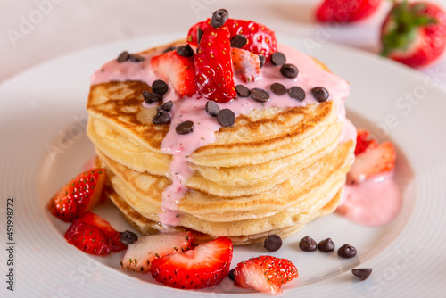 Strawberry pancakes on a white background.
