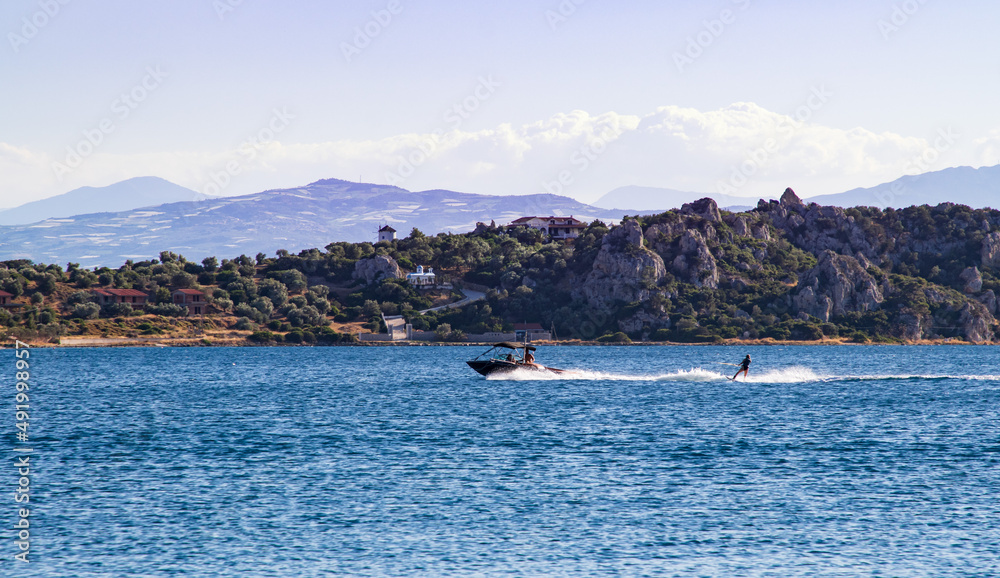Waterskiing during the summer on sea, beautiful seascape, Greece