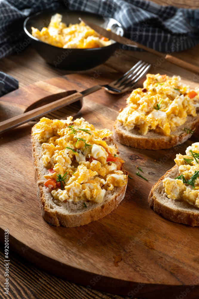 Scrambled eggs on a slice of bread. Scrambled eggs on a slice of bread.