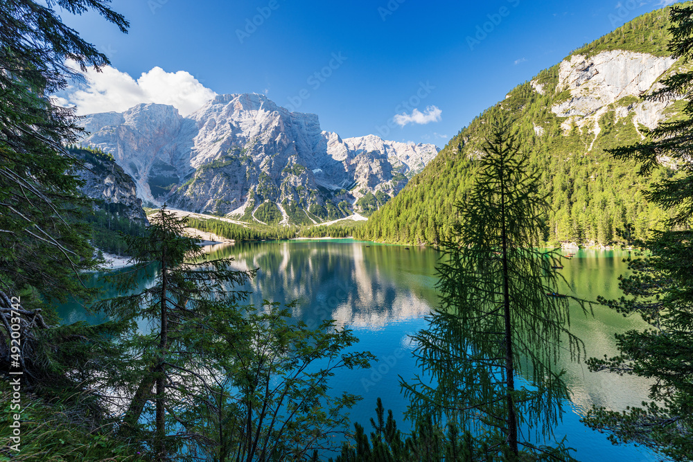 Fototapeta premium Braies Lake (Lago di Braies or Pragser Wildsee) and the Mountain peak of Croda del Becco or Seekofel, Dolomites, South Tyrol, Trentino Alto Adige, Bolzano province, Italy, Europe.