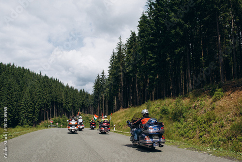 Bikers on the road in the middle of the mountains of Ukraine. Japanese Honda GoldWing motorcycle.