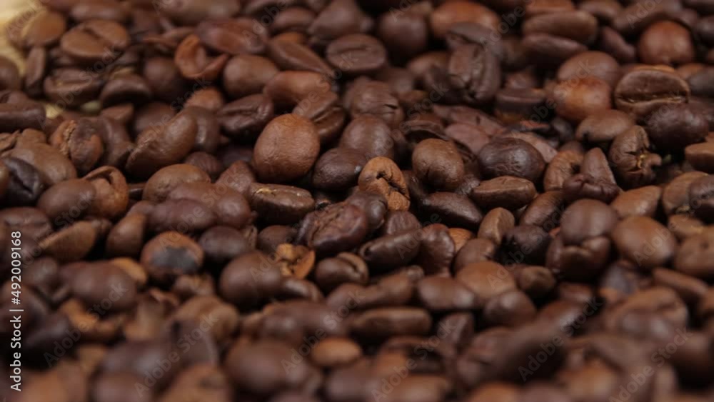 Roasted coffee beans as a background or backdrop, top view, close-up. Classic coffee color Roasted coffee beans as a background or backdrop, top view, close-up. Classic coffee color