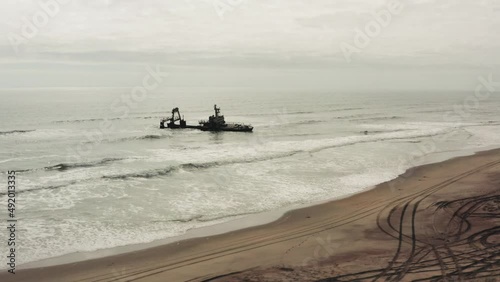 Abandoned Shipwreck Of Zelia India In The Atlantic Ocean, South Of Henties Bay On The Skeleton Coast In Namibia. drone shot photo