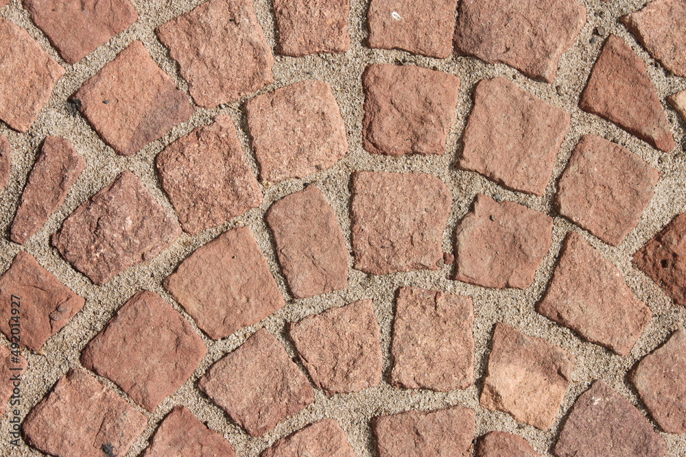 Close up of a red cobblestone walkway Close up of a red cobblestone walkway