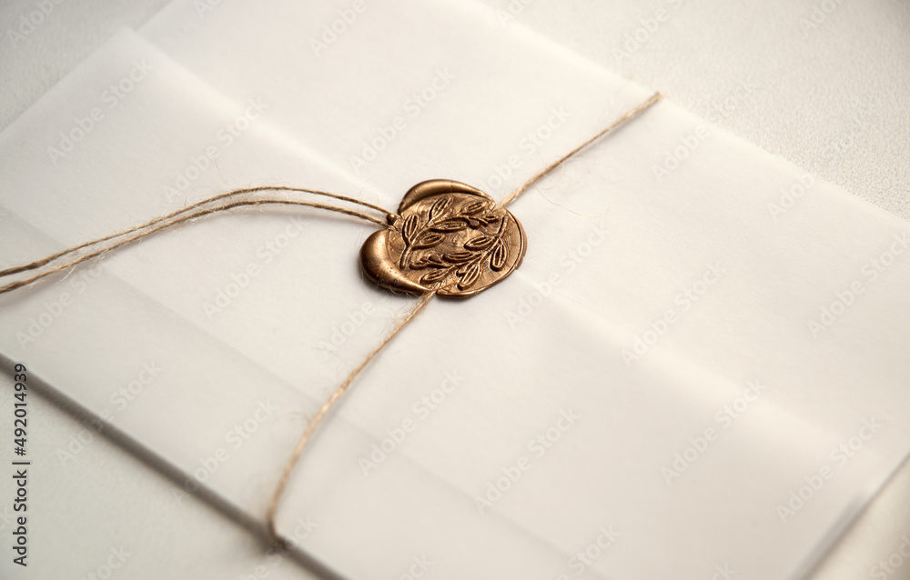 Fototapeta premium White envelope with a seal. Light background