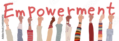 Group of raised arms of multicultural women and girls people holding letters in hand forming the text -Empowerment- Encouragement and success motivation self-empowerment concept.Isolated
