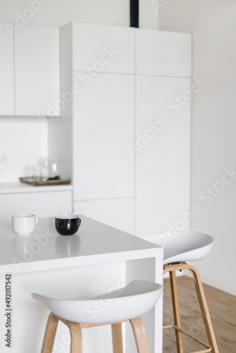 Scandinavian styled kitchen interior design in white tones