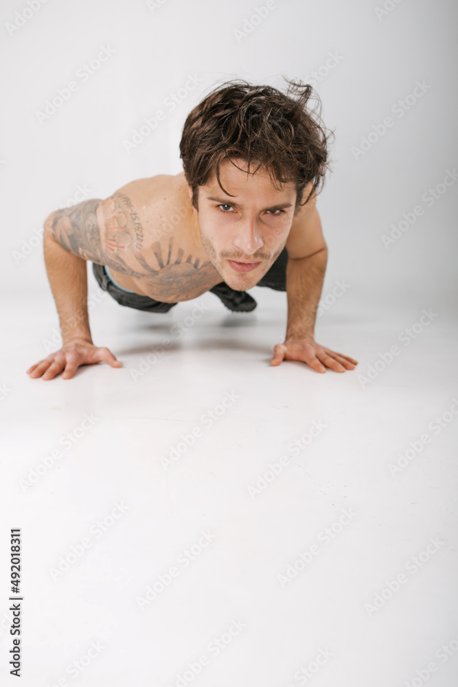Emotional portrait of a handsome guy with an athletic figure Emotional portrait of a handsome guy with an athletic figure