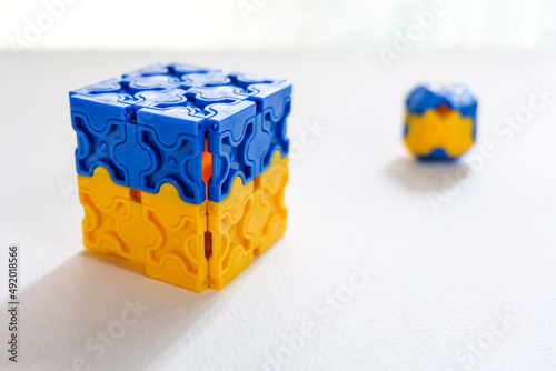 blue and yellow 3d cube on white background