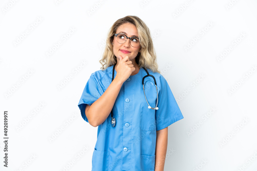 Brazilian surgeon doctor woman over isolated background and looking up Brazilian surgeon doctor woman over isolated background and looking up