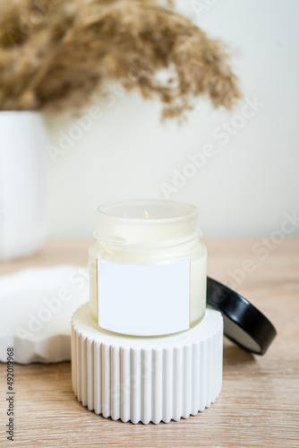 Elegant home decoration with wooden wick burning candle with label mock up