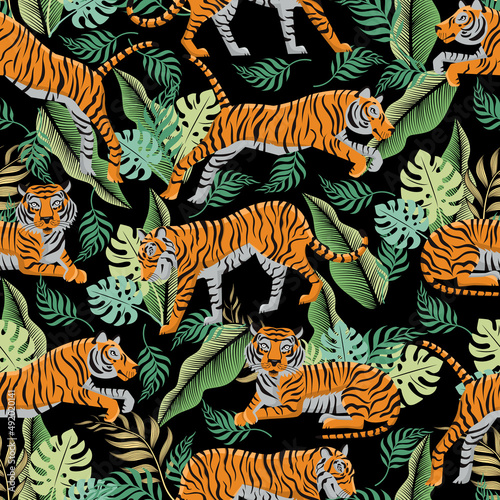 Seamless pattern with tigers and tropical leaves. Background with exotic plants and predatory animals. Fashionable template for fabrics and prints on clothes, wrapping paper. Vector illustration.
