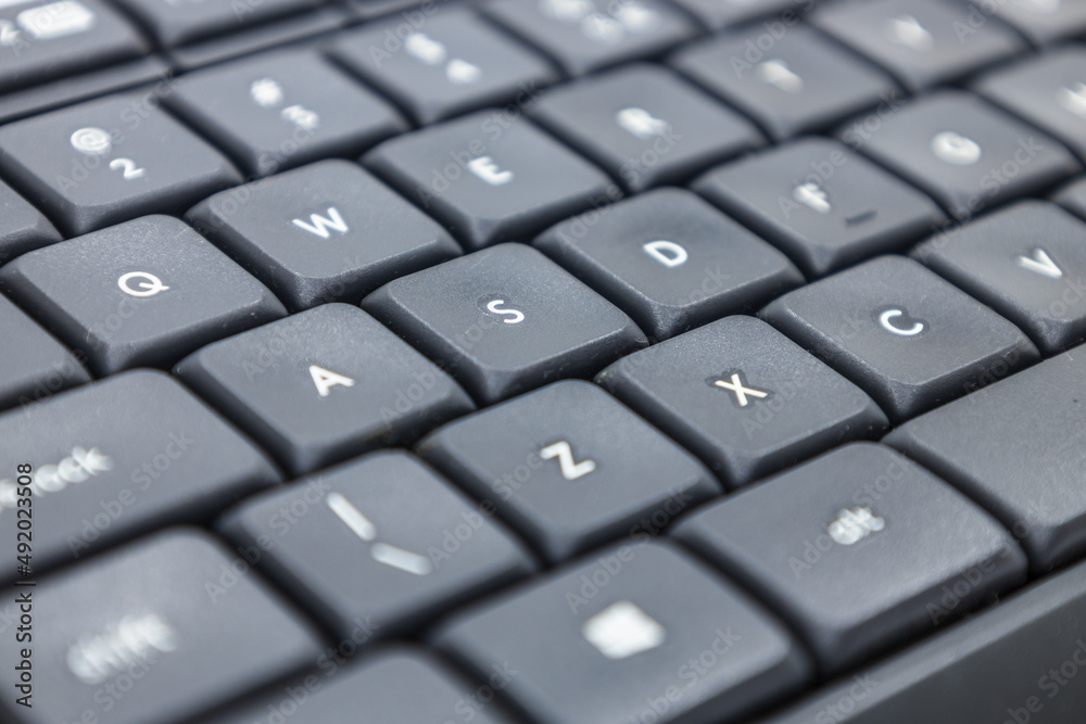 Closeup shot of a modern black computer keyboard Closeup shot of a modern black computer keyboard