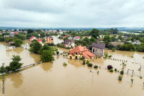 Aerial view of flooded houses with dirty water of Dnister river in Halych town, western Ukraine photo