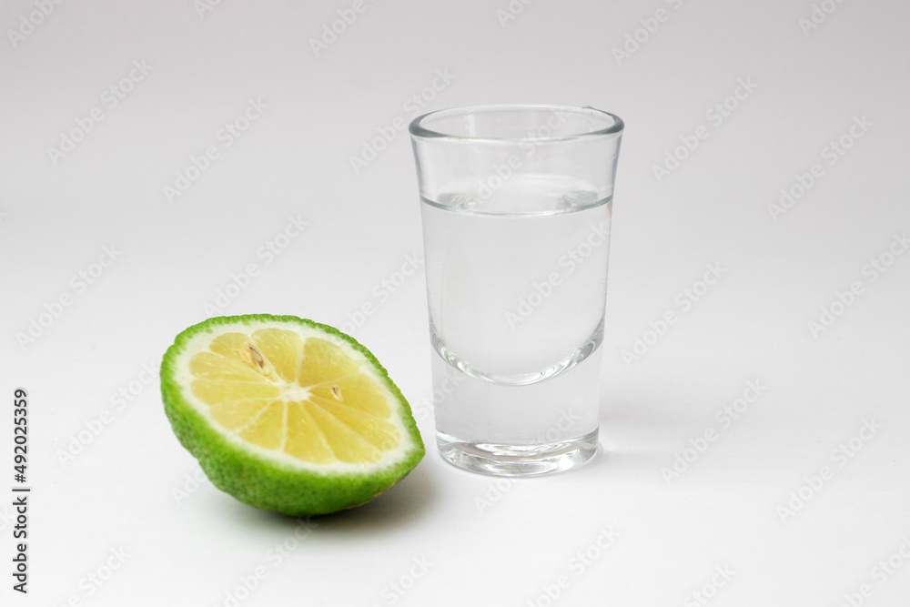 tequila shot with lime isolated on white tequila shot with lime isolated on white