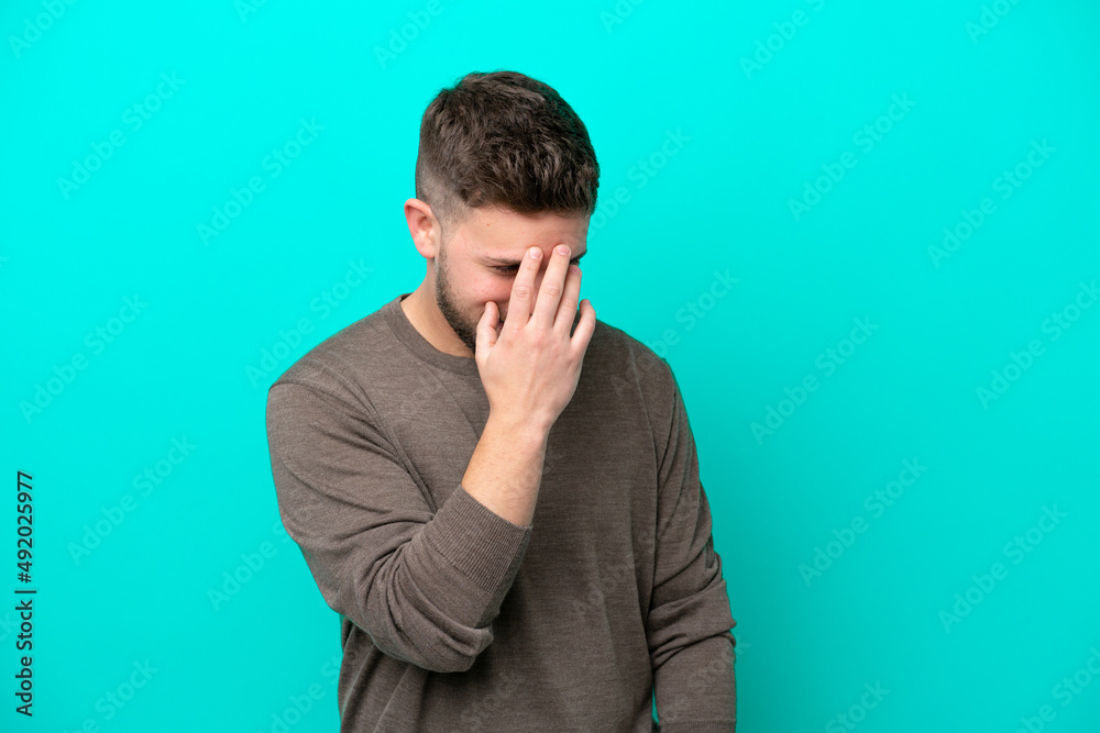 Young caucasian man isolated on blue background laughing Young caucasian man isolated on blue background laughing