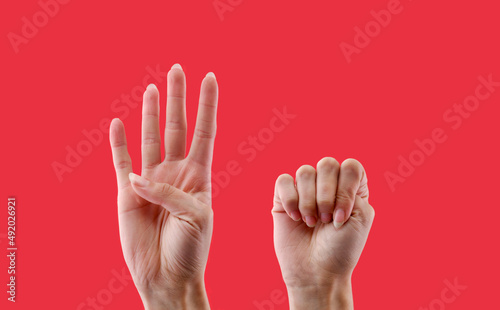 Gestural sign of help male violence on red background photo