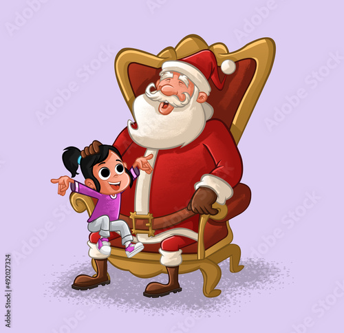 Santa Claus seated on armchair with a boy on his lap
