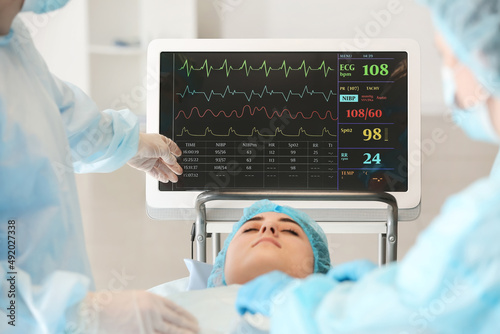 Team of surgeons operating ...