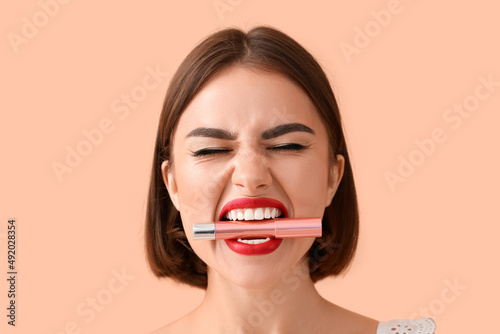 Emotional young woman with ...