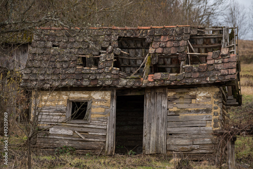 Sunja, Croatia, April 20,2021 :Abandoned traditional old wooden house. 