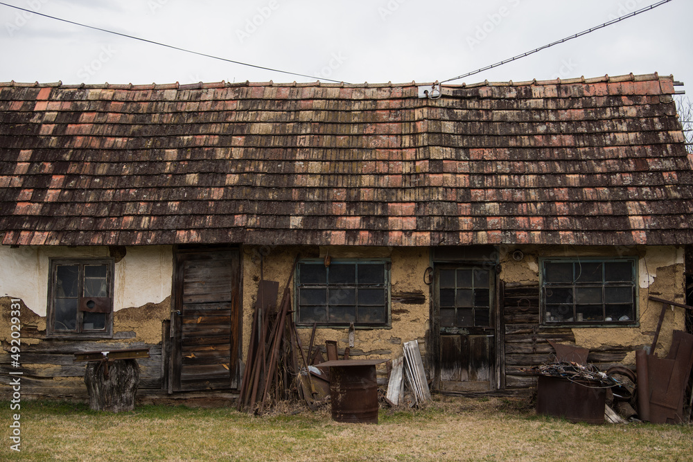 Sunja, Croatia, April 20,2021 :Abandoned traditional old wooden house. Sunja, Croatia, April 20,2021 :Abandoned traditional old wooden house.