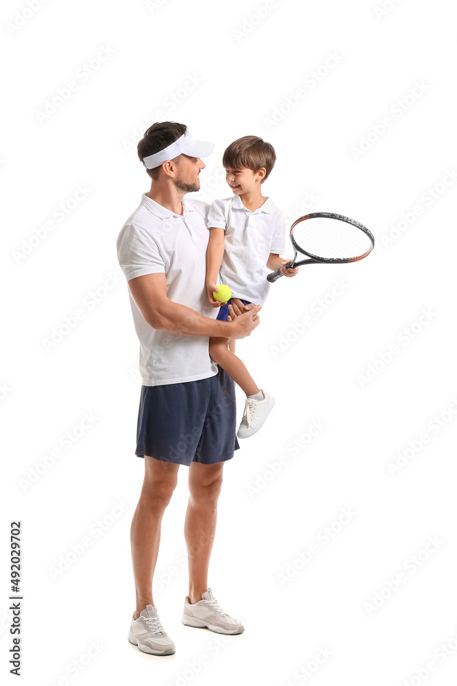 Little boy and his father with tennis racket and ball on white background Little boy and his father with tennis racket and ball on white background