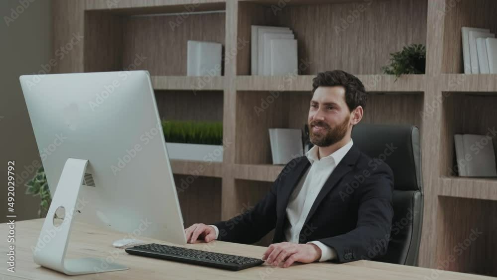 Satisfied and relaxed executive feels relieved at his workplace. Leaning backwards in his office chair. Satisfied and relaxed executive feels relieved at his workplace. Leaning backwards in his office chair.