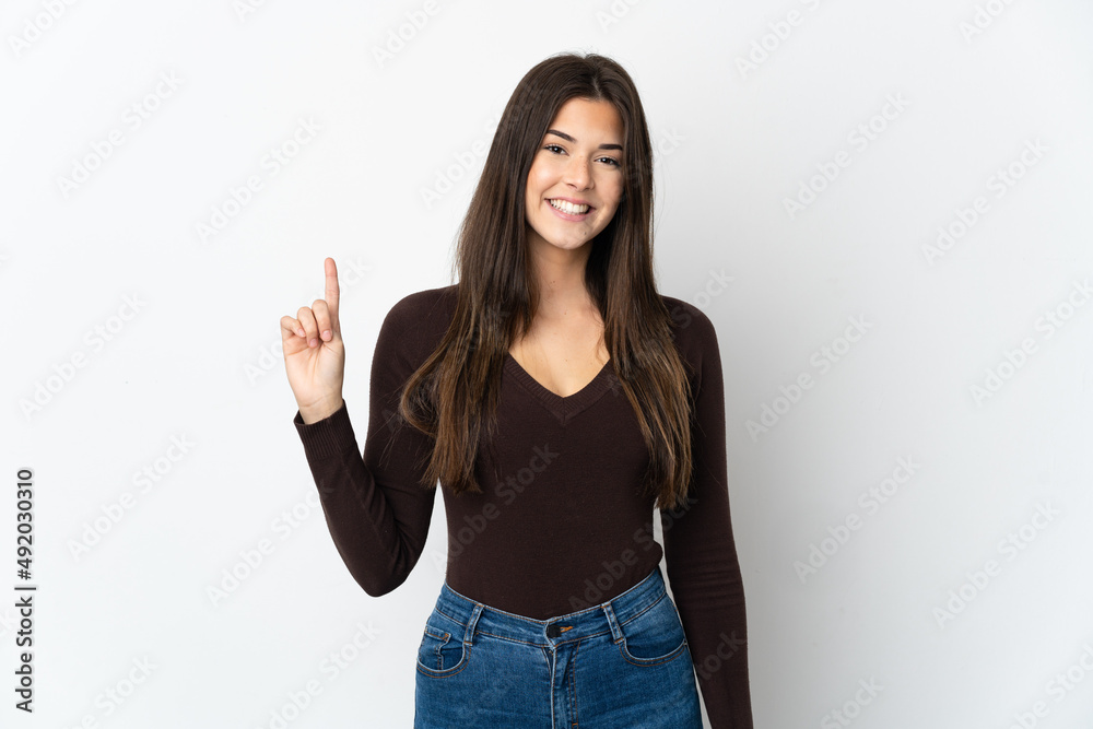 Teenager Brazilian girl isolated on white background showing and lifting a finger in sign of the best Teenager Brazilian girl isolated on white background showing and lifting a finger in sign of the best