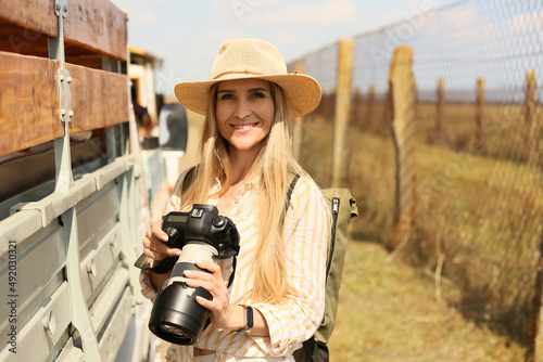 Beautiful female tourist wi...
