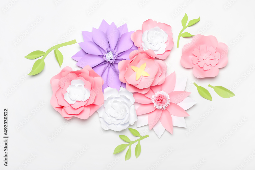 Beautiful handmade paper flowers on light background