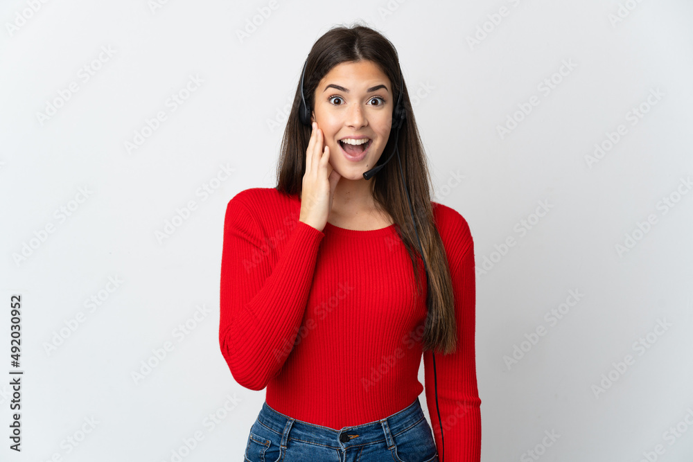 Young Brazilian telemarketer girl over isolated background with surprise and shocked facial expression Young Brazilian telemarketer girl over isolated background with surprise and shocked facial expression