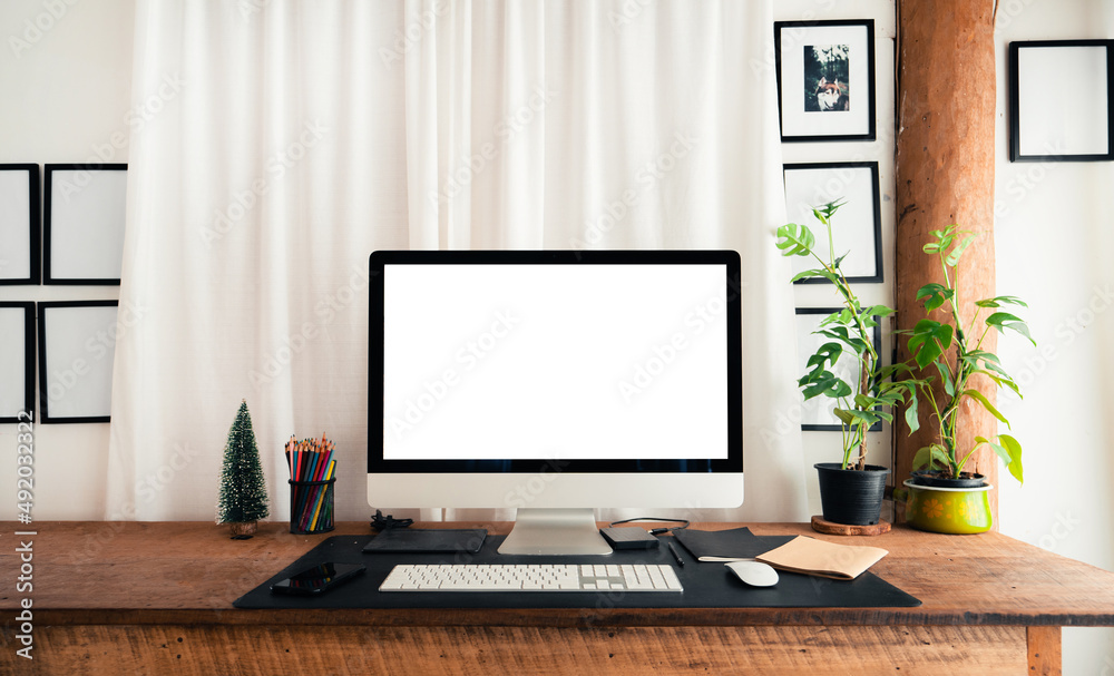 home office desk,Computer screen on a wooden table in the house home office desk,Computer screen on a wooden table in the house