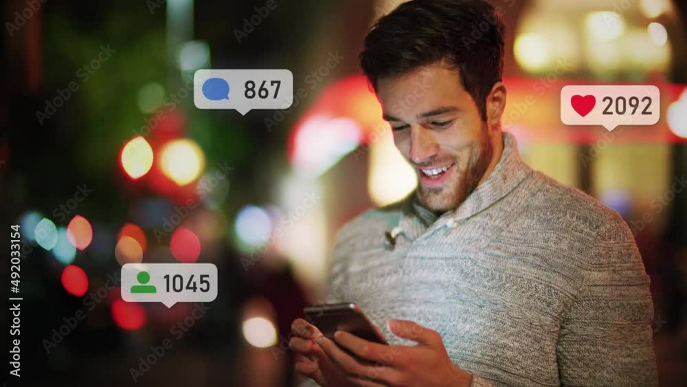 
Handsome Focused Caucasian Man Checking his Social Media Account in Crowded City at Night. 
Animated Social Media Icons, Likes, Comments and Followers Counter Increasing