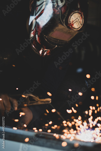 welder, welding automotive part in a car factory