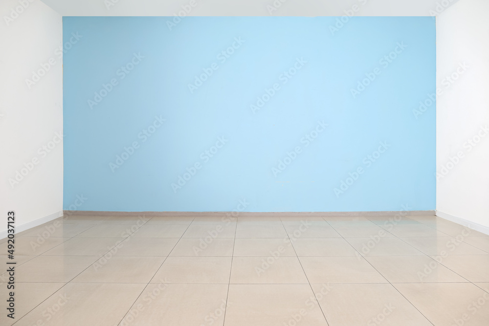 View of blue wall in big empty room