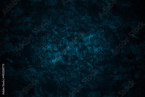Dark blue painted abstract grunge textured rustic surface of an old stone wall for background
