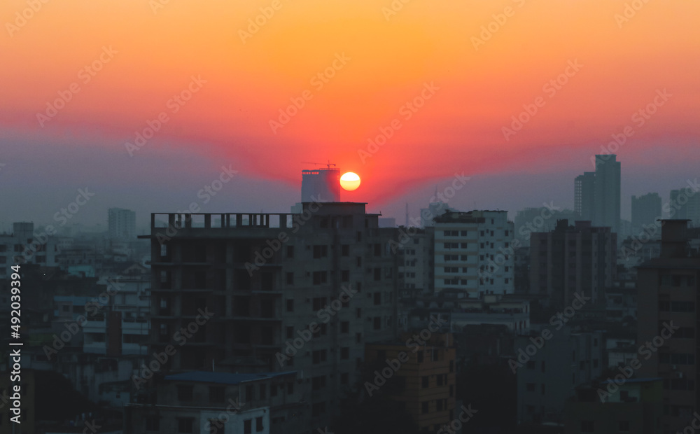 Sunset or sunrise at the city with building silhouette. Sunrise cityscape. Copy space.