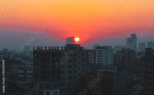 Sunset or sunrise at the city with building silhouette. Sunrise cityscape. Copy space.