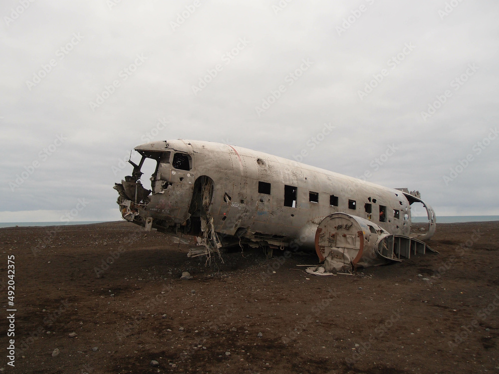 The abandoned DC-3 Airplane on Solheimasandur beach. Airplane wreckage on black sand beach. Douglas Dakota DC3, US navy, South Iceland.