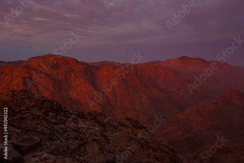 Beautiful sunrise on the summit of the Mount Sinai (Mount Horeb, Holy Mount Moses or Gabal Musa), Egypt, North Africa.
