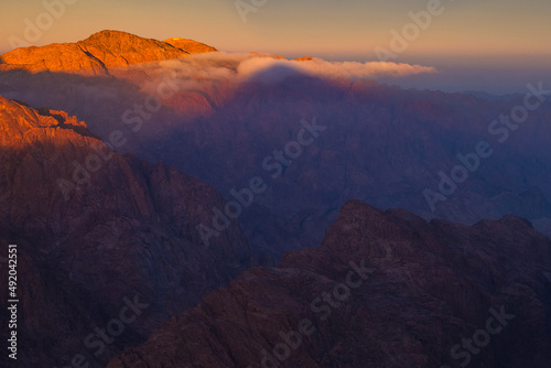 Beautiful sunrise on the summit of the Mount Sinai (Mount Horeb, Holy Mount Moses or Gabal Musa), Egypt, North Africa. photo