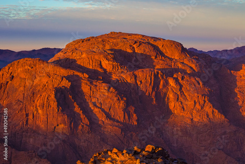 Beautiful sunrise on the summit of the Mount Sinai (Mount Horeb, Holy Mount Moses or Gabal Musa), Egypt, North Africa. photo