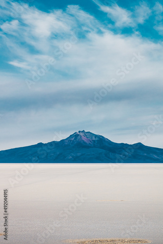 Salt desert with mountain in the background in Bolivia - Uyuni Salt Flat