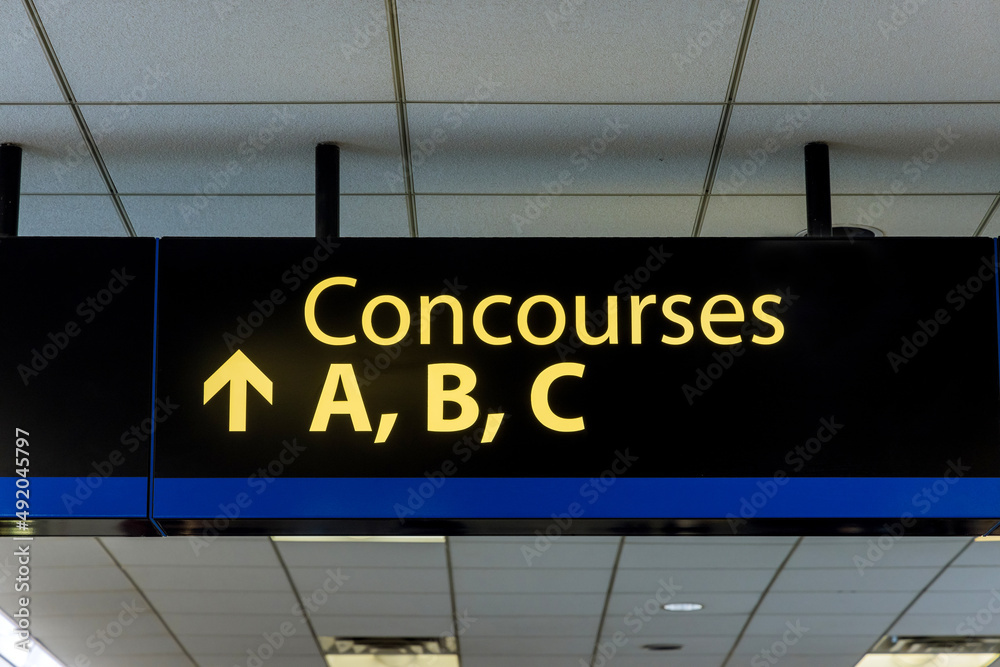 International Airport Sign Concourses A B C in air terminal International Airport Sign Concourses A B C in air terminal