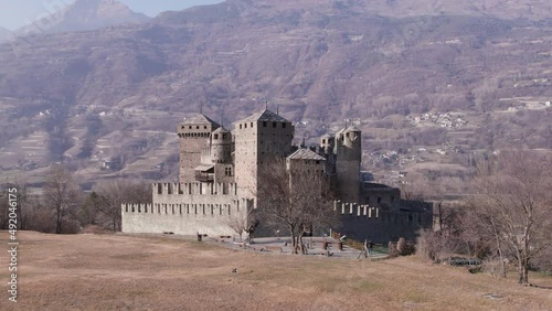 Aerial vertical parallax view of the architcture of Fenis Castle in Aosta Valley in the Alps in a winter afternoon. photo