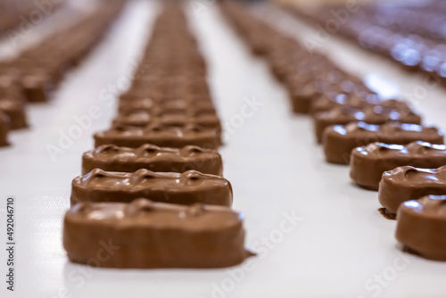 Production of chocolate bars. Confectionery factory. photo