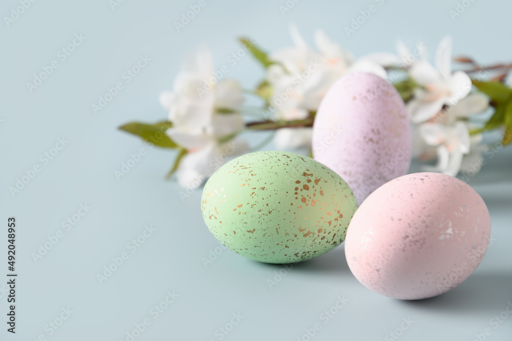Easter composition with pastel eggs and blossom spring flowers for Happy holiday and celebration. Close up. Greeting card. Easter composition with pastel eggs and blossom spring flowers for Happy holiday and celebration. Close up. Greeting card.