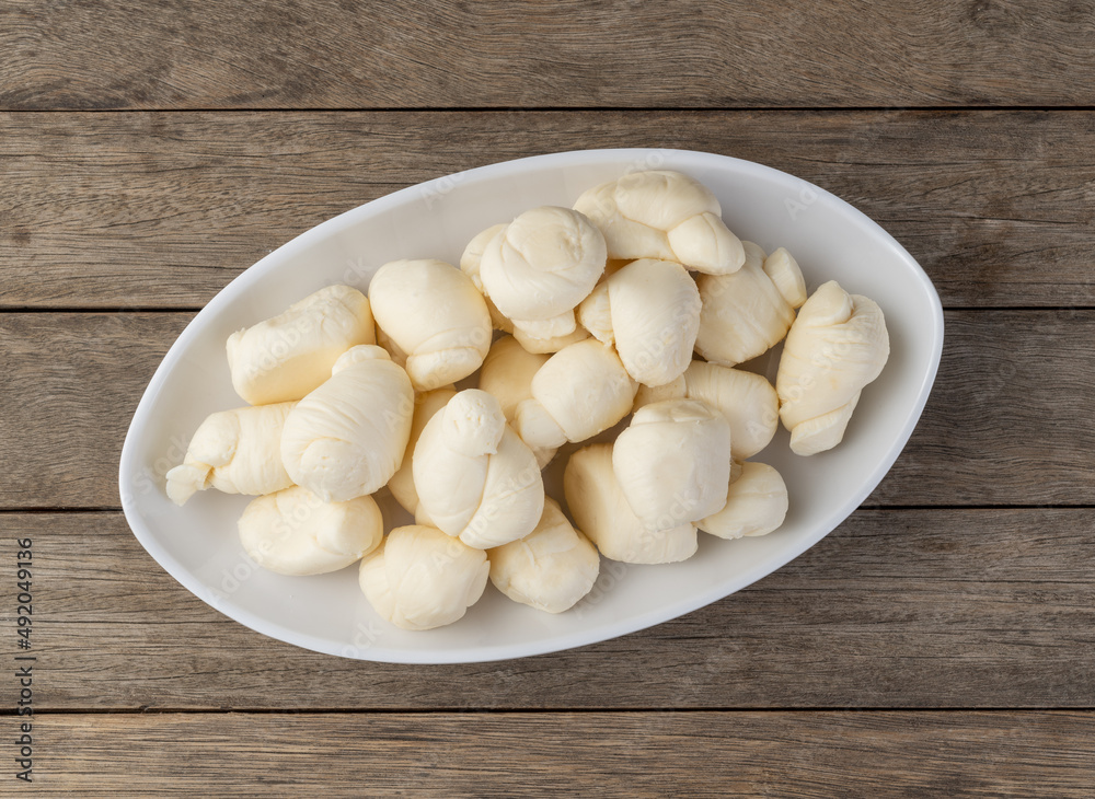 Nozinho or Knot mozzarella, typical brazilian artisanal fresh white cheese Nozinho or Knot mozzarella, typical brazilian artisanal fresh white cheese