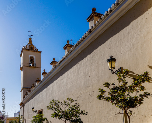 the historic church in the old city center of Berja under a blue sky photo